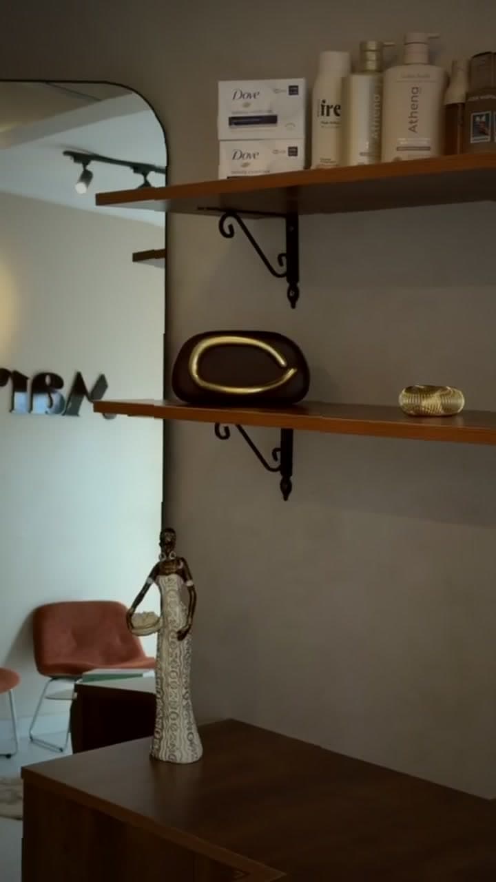 Care products arranged on the studio shelves